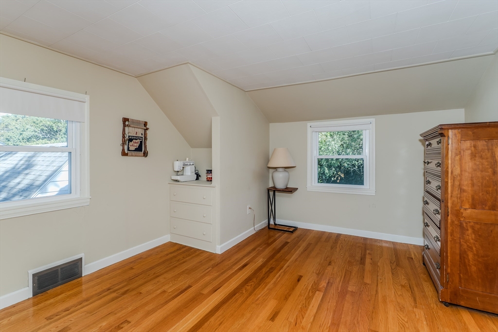 57 Lumae Street Springfield, MA 01119 - Photo 32 of 36 a view of empty room with wooden floor and fan