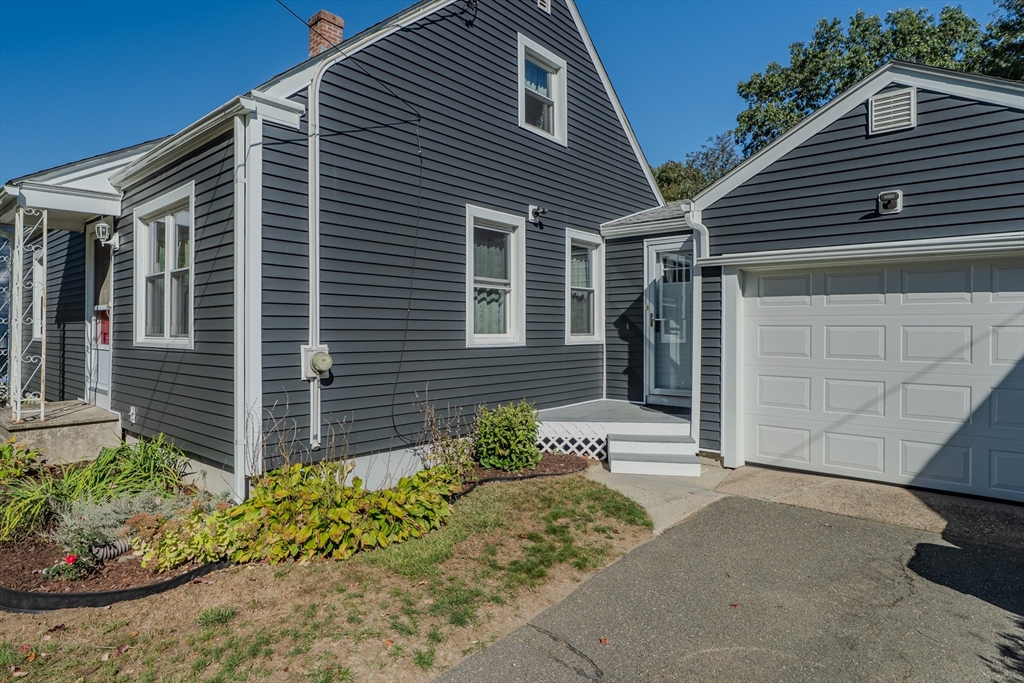 57 Lumae Street Springfield, MA 01119 - Photo 8 of 36 a front view of a house with a yard