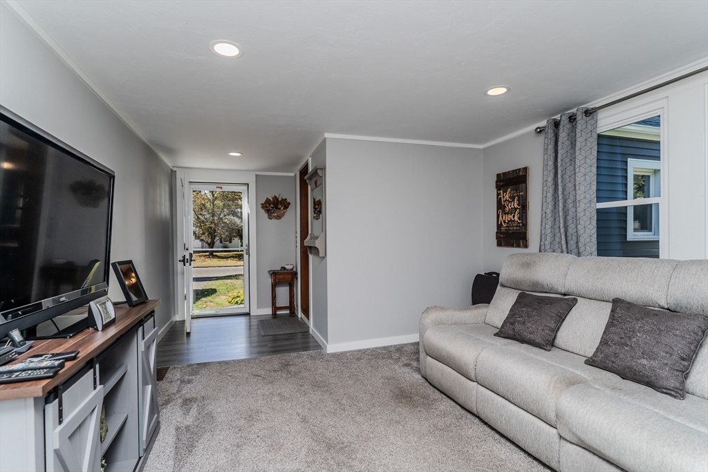 57 Lumae Street Springfield, MA 01119 - Photo 9 of 36 a living room with furniture and a flat screen tv
