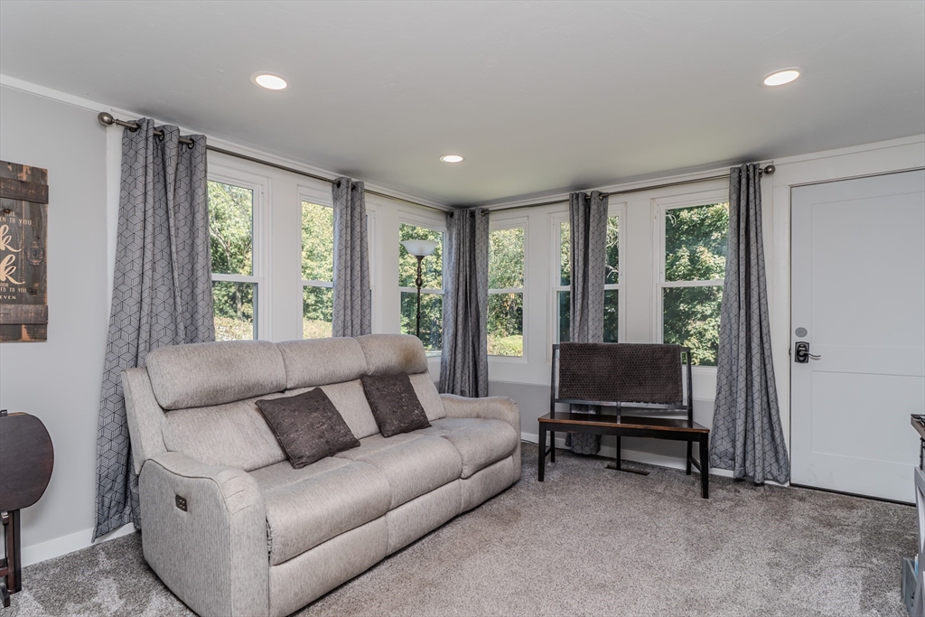 57 Lumae Street Springfield, MA 01119 - Photo 10 of 36 a living room with furniture and a window