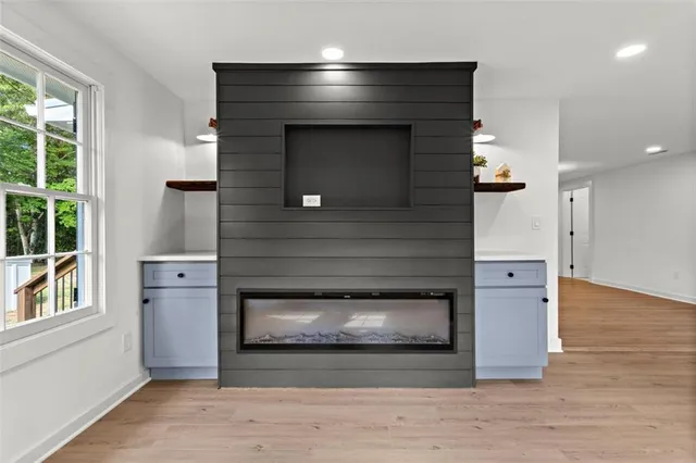 a living room with a fireplace and a table