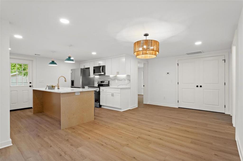 505 Cedar Creek Road Cartersville, GA 30121 - Photo 16 of 32 a view of kitchen with wooden floor and window