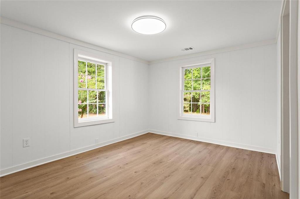 505 Cedar Creek Road Cartersville, GA 30121 - Photo 18 of 32 an empty room with wooden floor and windows