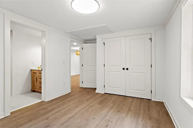 a view of an empty room and wooden floor