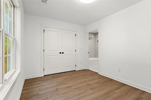 an empty room with wooden floor