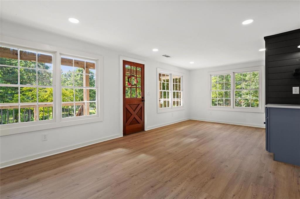 505 Cedar Creek Road Cartersville, GA 30121 - Photo 9 of 32 a view of an empty room with wooden floor and a window