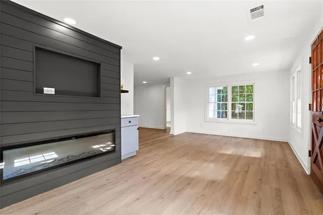 a view of an empty room and a window