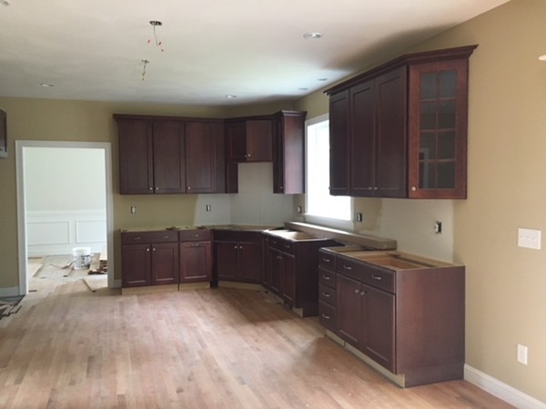 Lot 30 Mockingbird Hill Road Groton, MA 01450 - Photo 3 of 8 a kitchen with stainless steel appliances granite countertop a stove a sink and a refrigerator