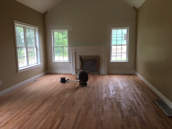 Lot 30 Mockingbird Hill Road Groton, MA 01450 - Photo 4 of 8 an empty room with fireplace and windows