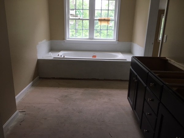 Lot 30 Mockingbird Hill Road Groton, MA 01450 - Photo 7 of 8 a bathroom with a bathtub and a window