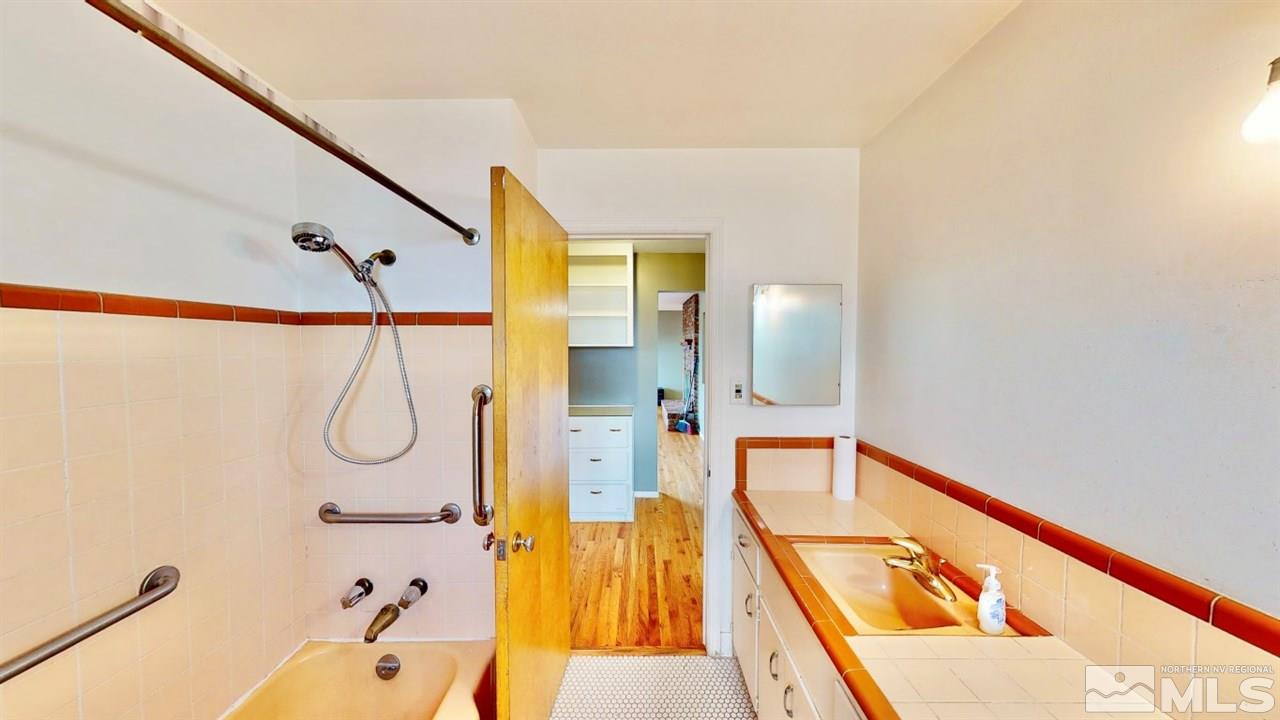 795 Thoma Street Reno, NV 89502 - Photo 15 of 40 a bathroom with a bathtub and a shower