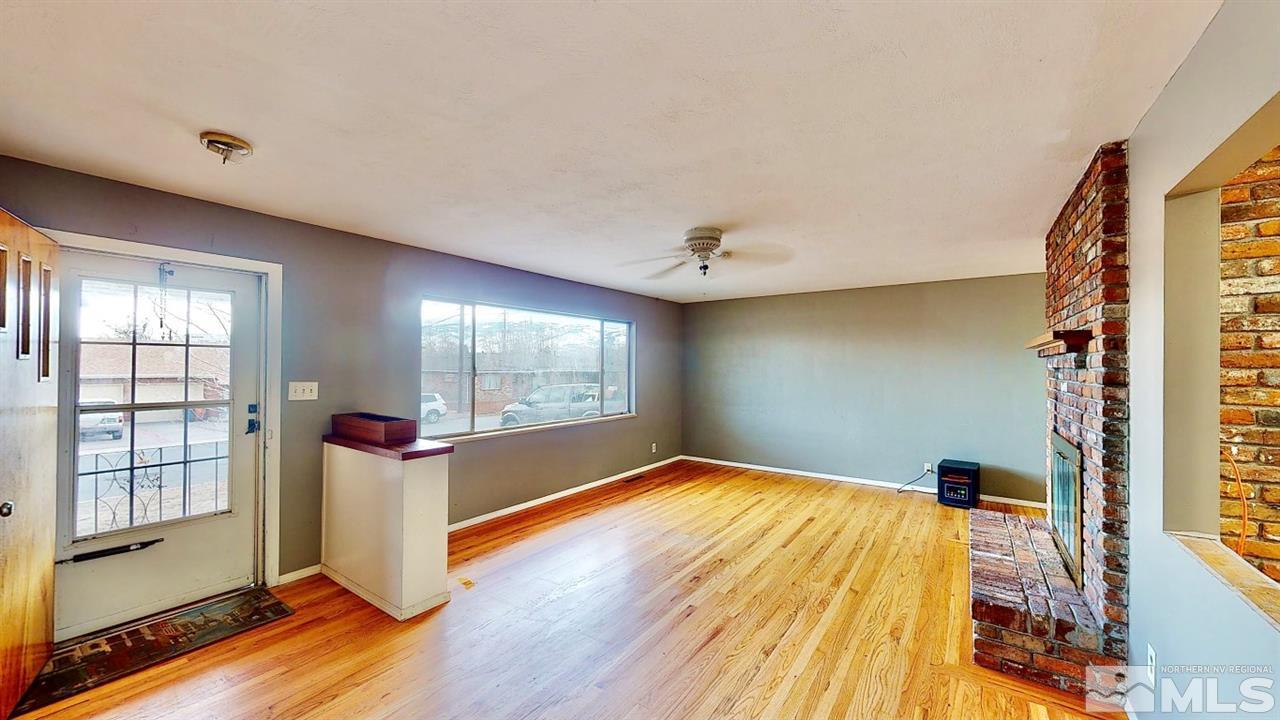 795 Thoma Street Reno, NV 89502 - Photo 3 of 40 a bedroom with a bed and wooden floor