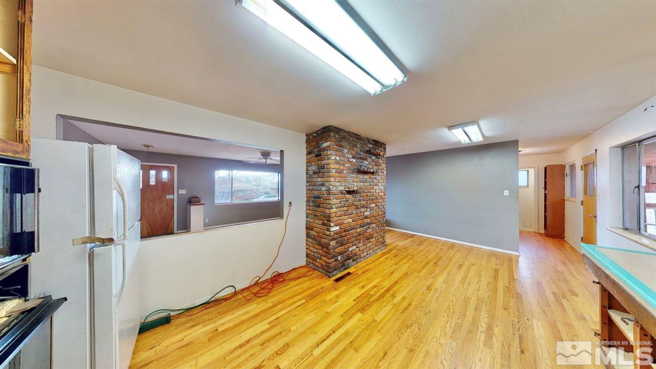 795 Thoma Street Reno, NV 89502 - Photo 8 of 40 a view of a bedroom with wooden floor and windows