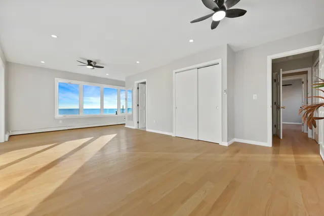 a view of an empty room and a window