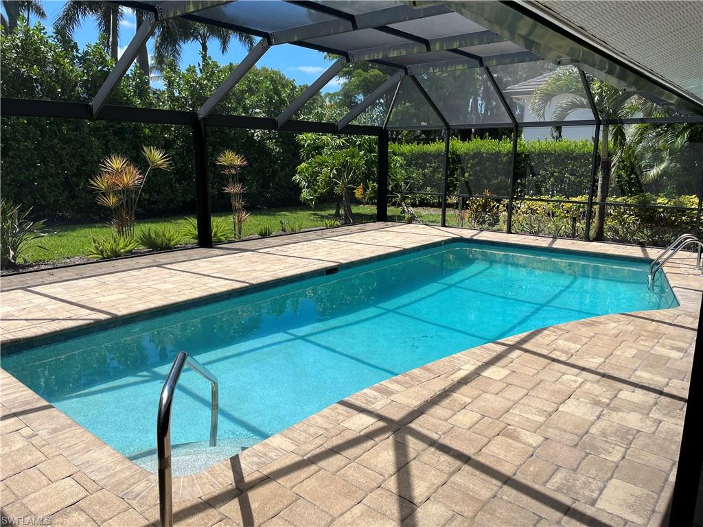 a view of swimming pool with a patio