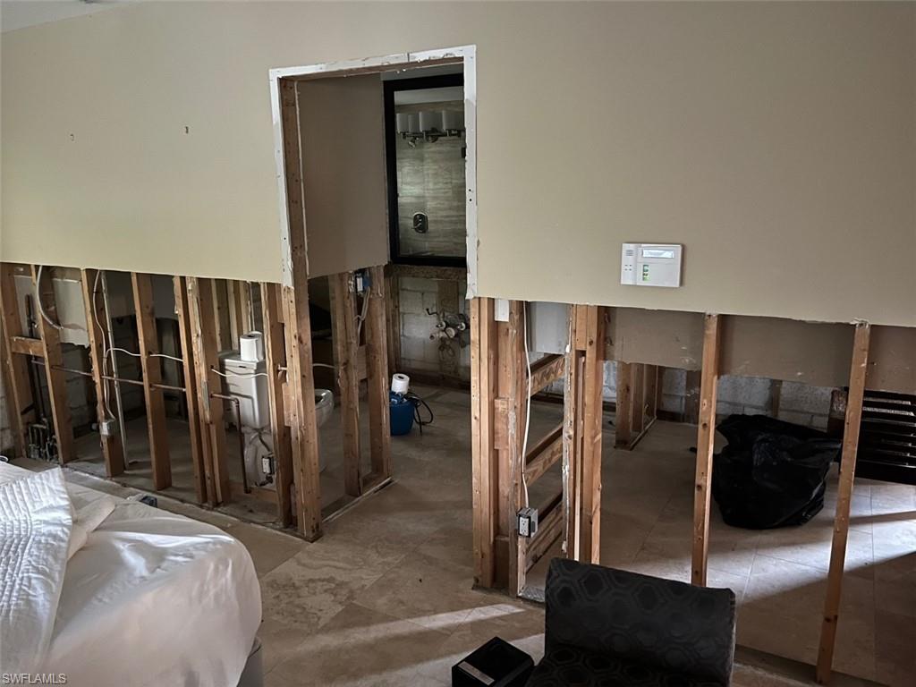 718 Old Trail Drive Naples, FL 34103 - Photo 11 of 18 a view of a livingroom with furniture and storage