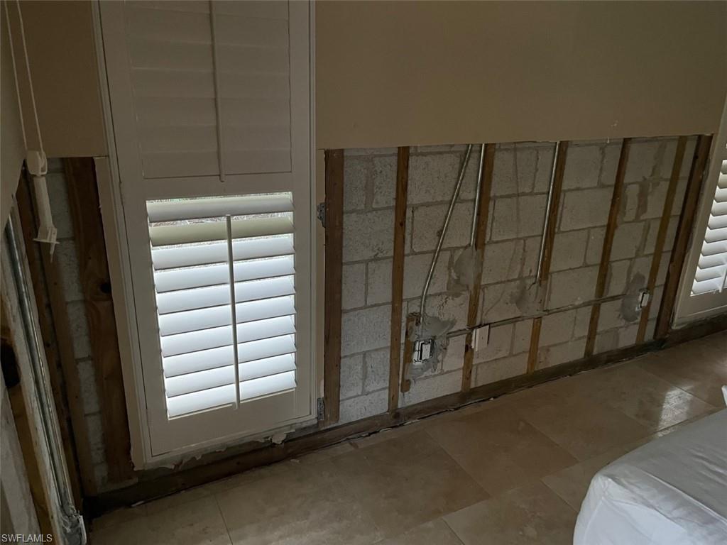718 Old Trail Drive Naples, FL 34103 - Photo 12 of 18 a view of a closet area with empty racks