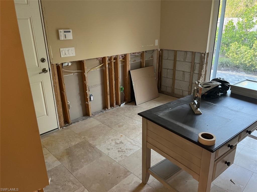 718 Old Trail Drive Naples, FL 34103 - Photo 17 of 18 a room with furniture and a window