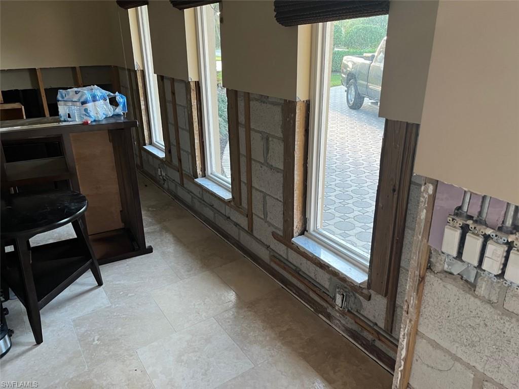 718 Old Trail Drive Naples, FL 34103 - Photo 9 of 18 a view of living room with furniture and a flat tv screen