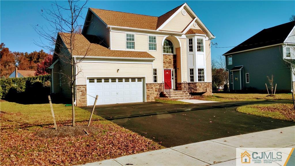 2030 Oak Tree Road Edison, NJ 08820 - Photo 2 of 33 a view of a white house with a swimming pool