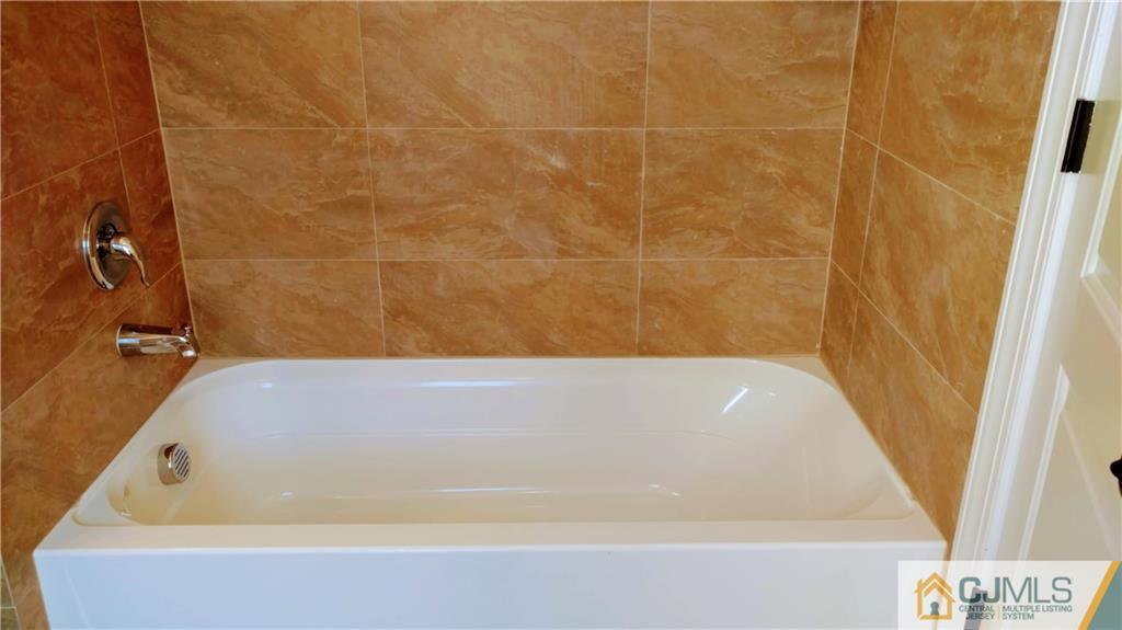 2030 Oak Tree Road Edison, NJ 08820 - Photo 16 of 33 a bathroom with a bathtub