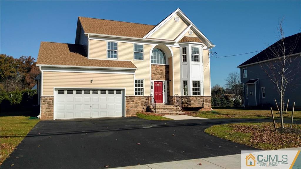 2030 Oak Tree Road Edison, NJ 08820 - Photo 3 of 33 a front view of a house with a yard