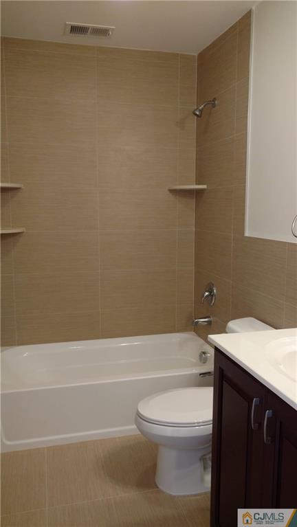2030 Oak Tree Road Edison, NJ 08820 - Photo 22 of 33 a bathroom with a sink a toilet and shower