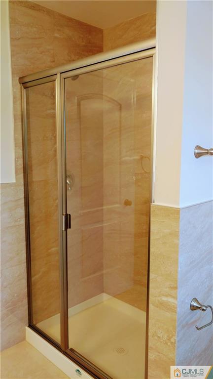 2030 Oak Tree Road Edison, NJ 08820 - Photo 27 of 33 a bathroom with a glass shower door