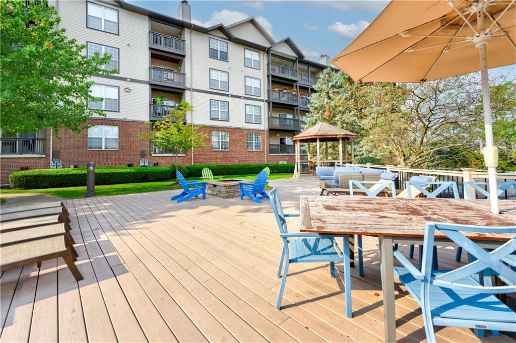 35 Highland Road Bethel Park, PA 15102 - Photo 11 of 49 a view of a patio with a table and chairs under an umbrella