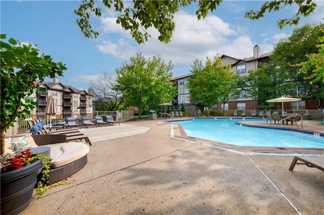 a view of a swimming pool with a patio