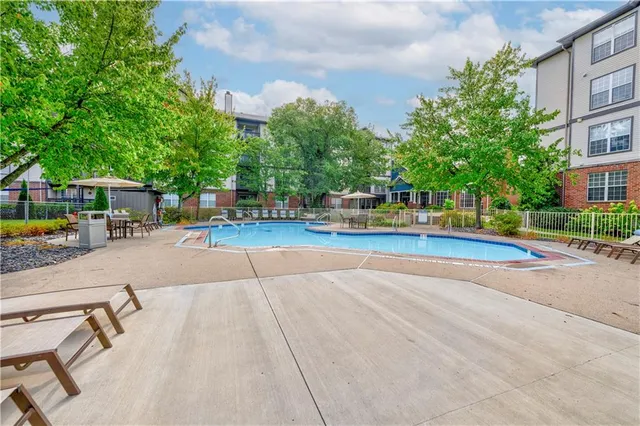 a view of a swimming pool with a patio