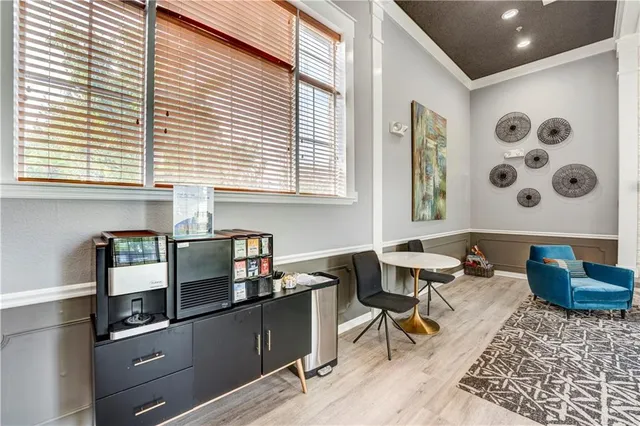 a kitchen with stainless steel appliances a stove a sink and a cabinets