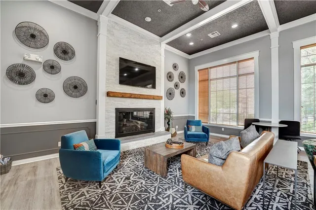 a living room with furniture and a fireplace