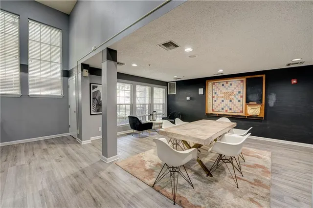 a view of a dining room with furniture window and wooden floor