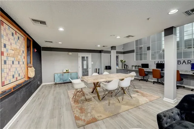 a living room with furniture window and wooden floor