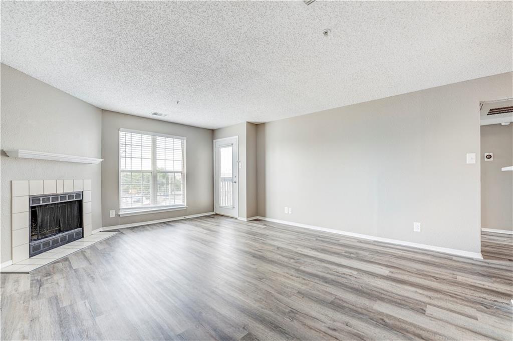 35 Highland Road Bethel Park, PA 15102 - Photo 40 of 49 a view of an empty room with wooden floor fireplace and a window