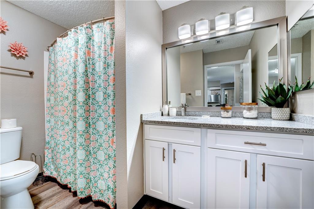 35 Highland Road Bethel Park, PA 15102 - Photo 47 of 49 a bathroom with a granite countertop sink and a mirror
