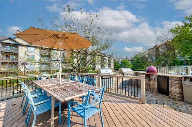 an outdoor space with furniture and umbrella
