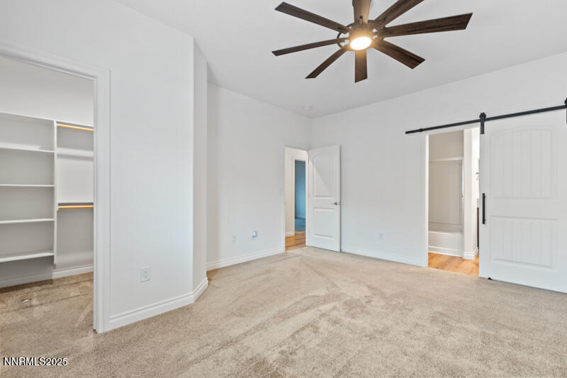 18697 Ginny Crk Court Reno, NV 89508 - Photo 12 of 23 a view of a big room with closet and chandelier fan