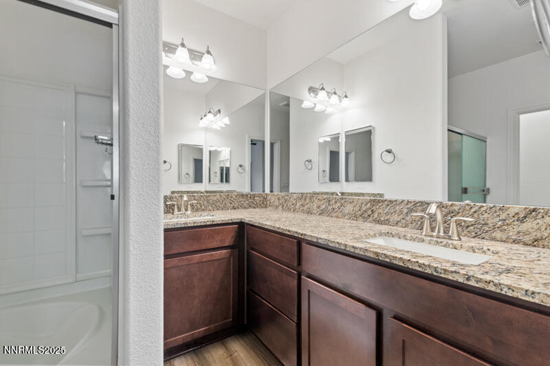 18697 Ginny Crk Court Reno, NV 89508 - Photo 14 of 23 a bathroom with a granite countertop sink and a mirror