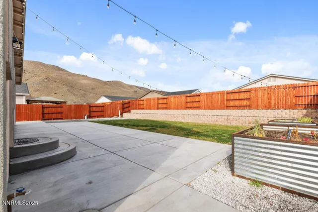 a view of an chairs and table in the patio