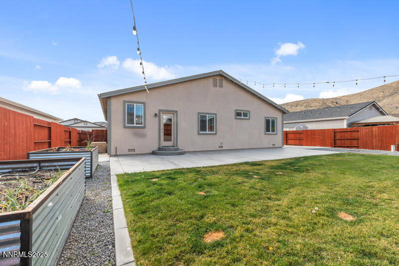 18697 Ginny Crk Court Reno, NV 89508 - Photo 23 of 23 a view of a backyard with plants and outdoor kitchen