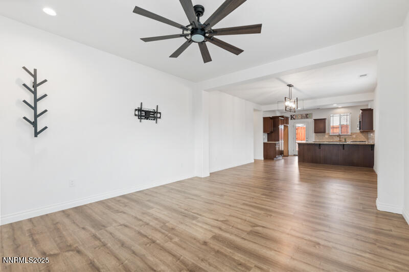 18697 Ginny Crk Court Reno, NV 89508 - Photo 5 of 23 a view of a livingroom with a ceiling fan hardwood floor a ceiling fan and staircase