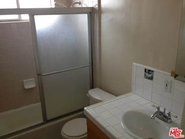 a bathroom with a sink and toilet
