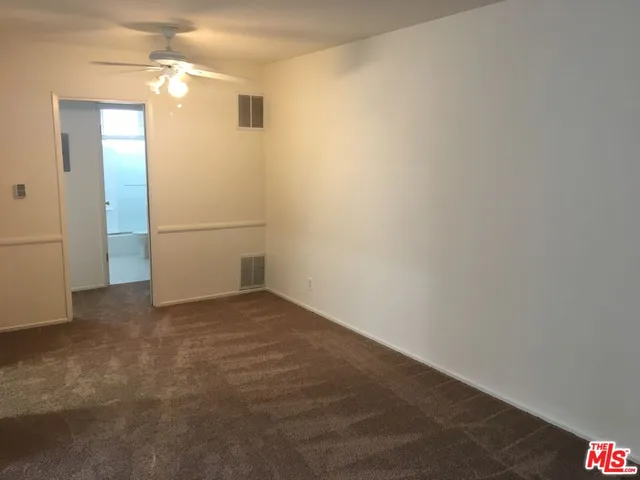 a view of a small space with wooden floor