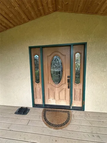 a front view of a house with a clock