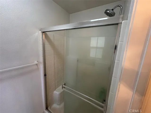 a bathroom with a sink a light fixture and a mirror