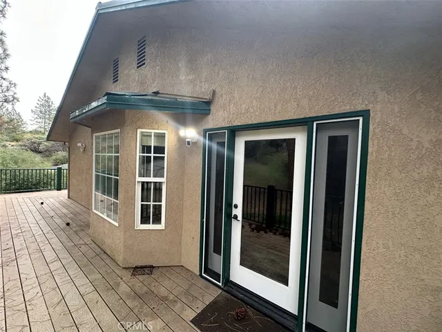 a view of a brick house with a large window