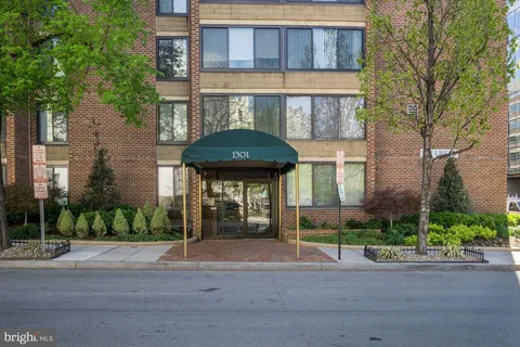 a front view of a building with garden
