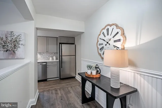 a bedroom with a bed and a lamp